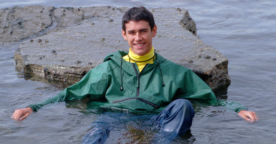 boy swimming in anoraks