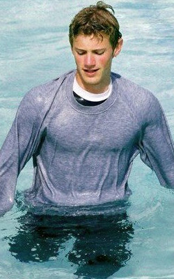 Sweatshirt over a tee shirt wading in swimming pool